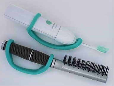 Assistive grooming tool with ergonomic grip