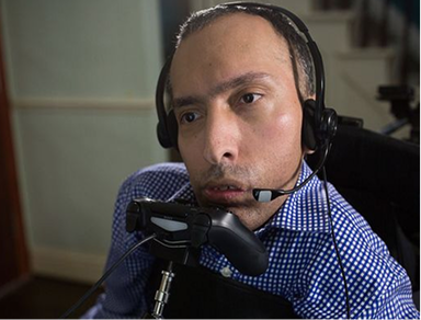 Man speaking with headset communication device